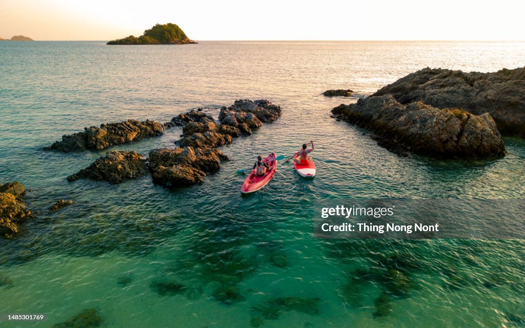 Aerial view - Two women enjoy the water aqua sport on the seaside.