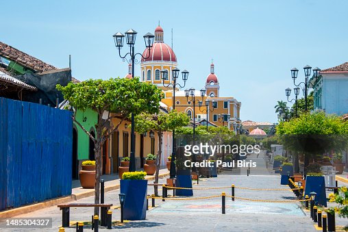 Panorama of a colorful street in Granada, Nicaragua with the cathedral in the background