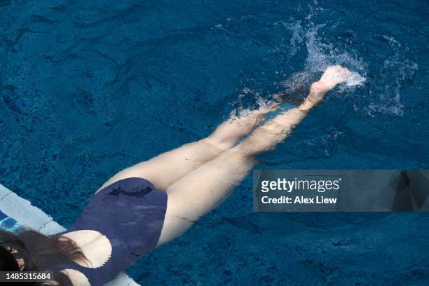 swimming - beautiful asian legs stock pictures, royalty-free photos & images