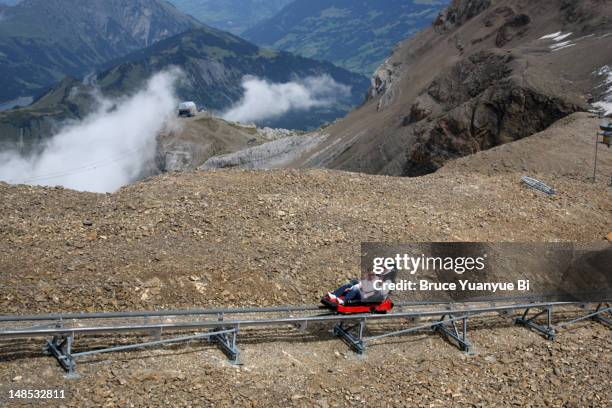 alpine coaster bobsleigh track on glacier 3000. - bobsleigh women stock pictures, royalty-free photos & images