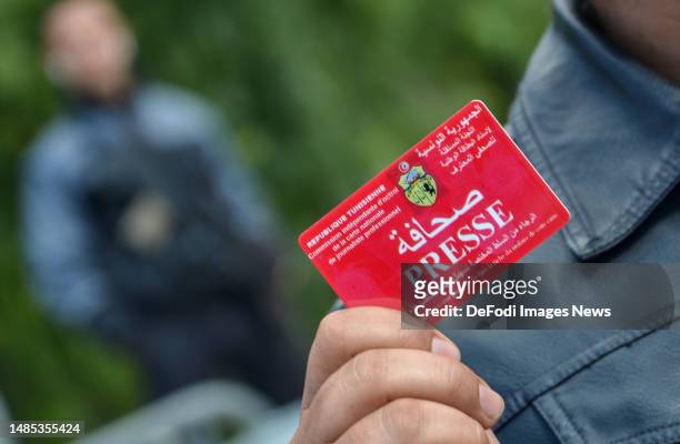 Journalist holding press card during a protest outside parliament against the targeting of the press freedom by the government and for their right to...