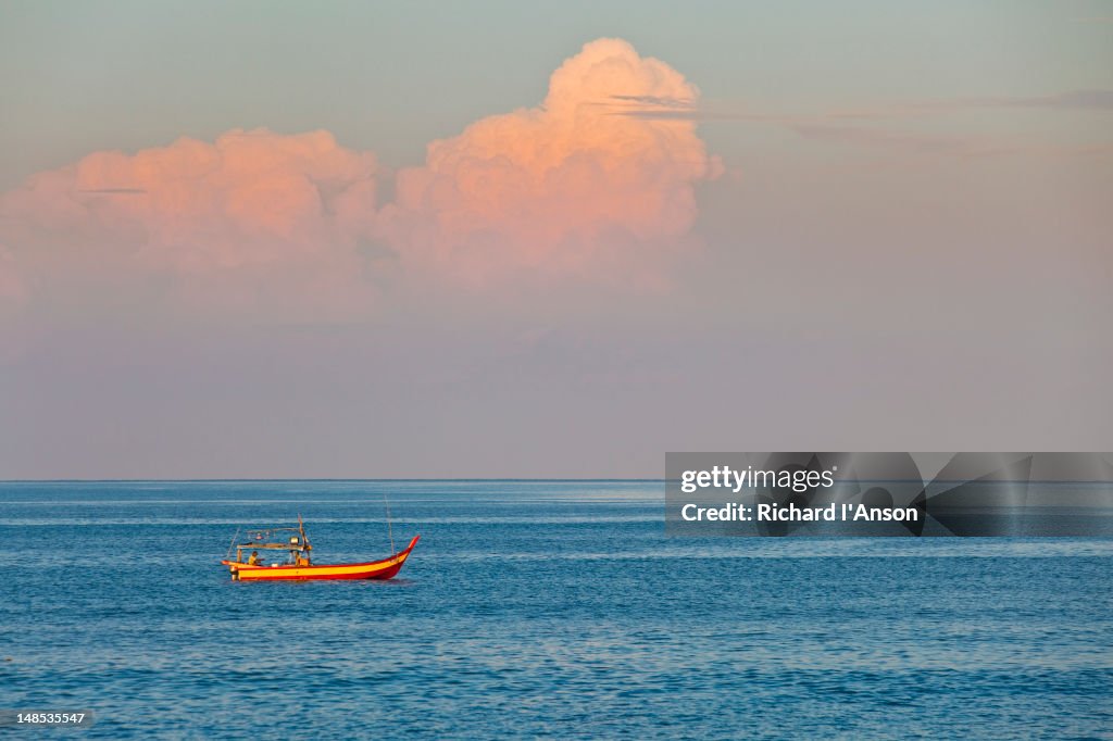 Fishing boat at sunrise, Pantai Kok.