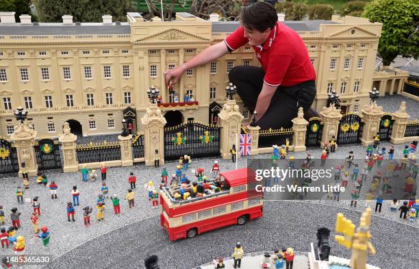 The Coronation of King Charles III is depicted in Lego during a photocall with model maker Daniel Anderson at Legoland Windsor on April 26, 2023 in...