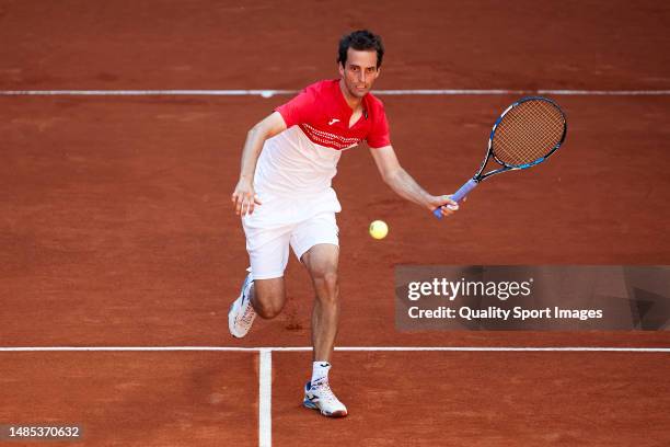 Albert Ramos-Vinolas of Spain runs to play a shot against Ilya Ivashka in their Men's Singles Round of 64 match during day three of Mutua Madrid Open...