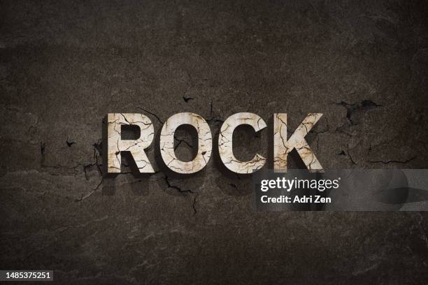 the word rock on a brown background with the letters broken - rock font stock pictures, royalty-free photos & images