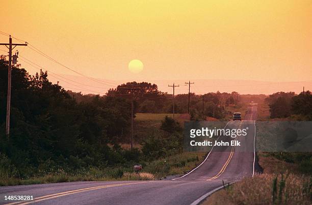 sunrise over kiamichi mountains and highway 63, between talihina and big cedar. - oklahoma stock pictures, royalty-free photos & images
