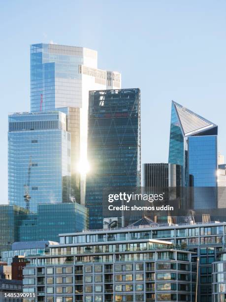 london financial district skyscrapers against clear sky - financial building stock pictures, royalty-free photos & images