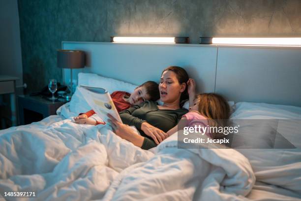 mom reading bed time stories - goodnight my love images stock pictures, royalty-free photos & images
