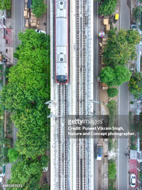 a metro train for local travel in lucknow, uttar pradesh - carbon footprint reduction stock pictures, royalty-free photos & images