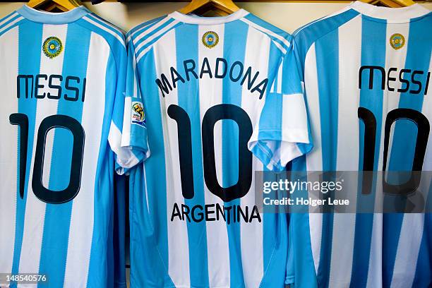 lionel messi and diego maradona argentine national football team jerseys for sale. - lionel messi argentina jersey stock pictures, royalty-free photos & images