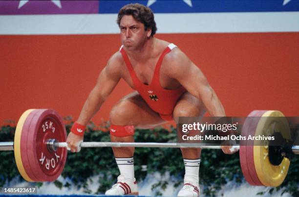 German weightlifter Rolf Milser competes in the men's 100 kg competition of the men's weightlifting events at the 1984 Summer Olympics, at the Albert...