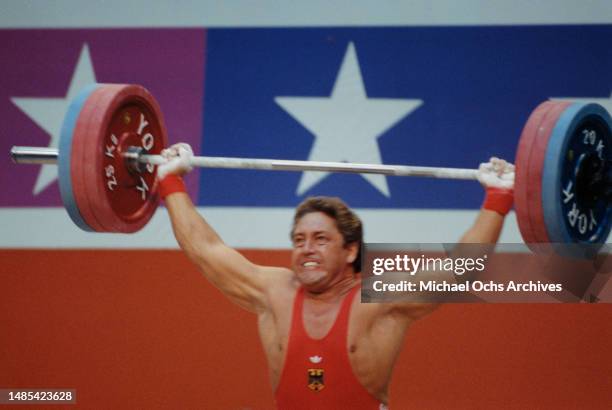 German weightlifter Rolf Milser competes in the men's 100 kg competition of the men's weightlifting events at the 1984 Summer Olympics, at the Albert...