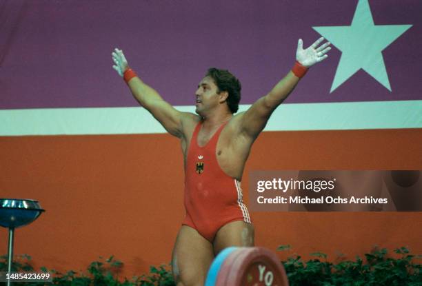 German weightlifter Rolf Milser celebrates during in the men's 100 kg competition of the men's weightlifting events at the 1984 Summer Olympics, at...