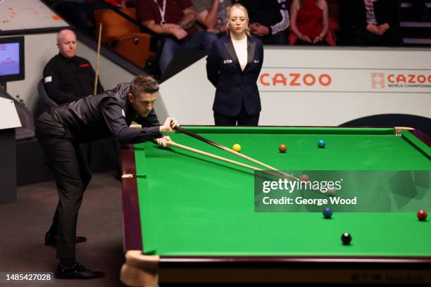 Mark Selby of England plays a shot during their Quarter Final match against John Higgins of Scotland on Day Twelve of the Cazoo World Snooker...