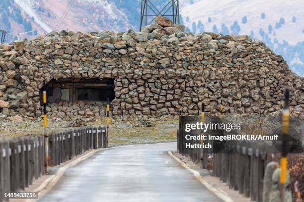 swiss military bunker for national defence, camouflaged in a boulder field on the albula pass, berguen, grisons, switzerland - military bunker stock pictures, royalty-free photos & images
