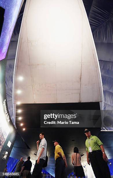 Visitors walk beneath the Space Shuttle Enterprise at a press preview of the Intrepid Sea, Air & Space Museum’s new Space Shuttle Pavilion on July...