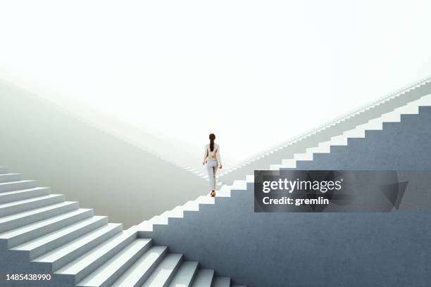 businesswoman walking between endless abstract  stairs - length concept stock pictures, royalty-free photos & images