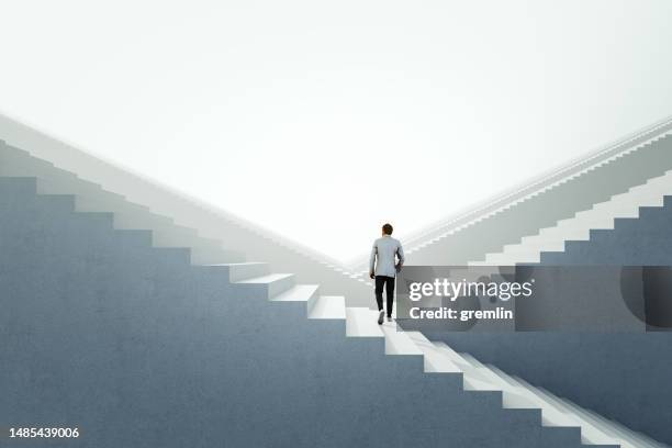 businessman walking between endless abstract  stairs - climbs to all time high stock pictures, royalty-free photos & images