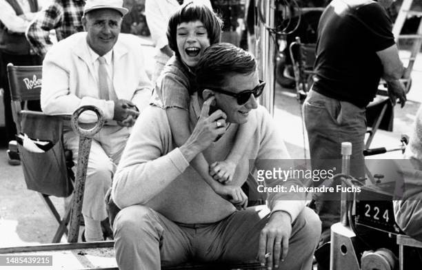 Actress Mary Badham plays with director Robert Mulligan while in the set of the film "To Kill A Mockingbird", in 1961 at Monroeville, Alabama.