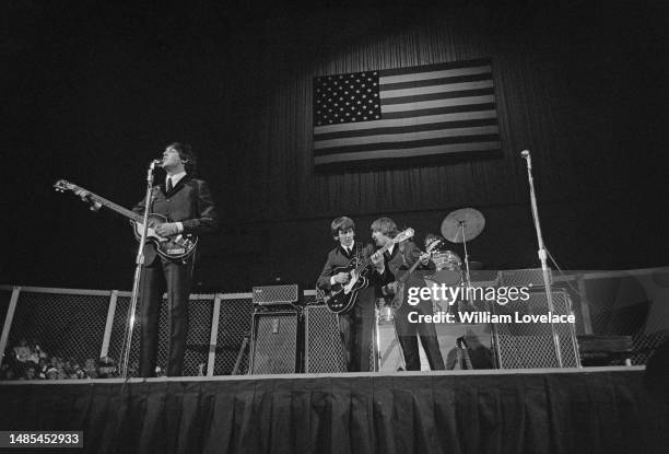 The Beatles perform at the Cow Palace in Daly City, California, during their Summer 1964 United States and Canada Tour, 19th August 1964. Left to...