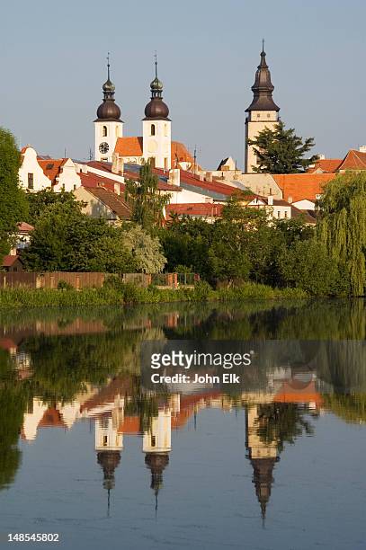 ulicky pond with holy spirit church. - moravia stock pictures, royalty-free photos & images