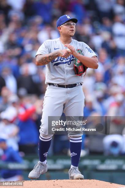 Julio Urias of the Los Angeles Dodgers reacts after allowing a home run to Trey Mancini of the Chicago Cubs during the third inning at Wrigley Field...