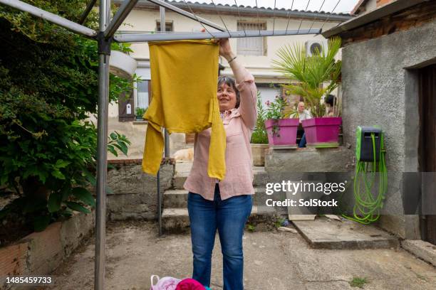 a good day for laundry - blind woman stock pictures, royalty-free photos & images