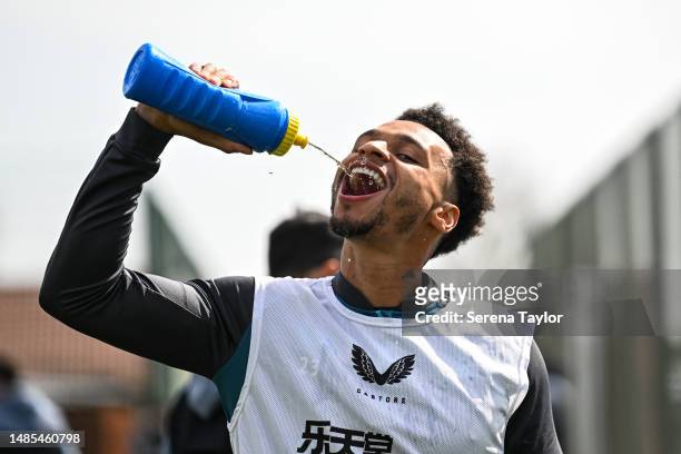 Jacob Murphy takes a drink during the Newcastle United Training Session at The Newcastle United Training Centre on April 26, 2023 in Newcastle upon...