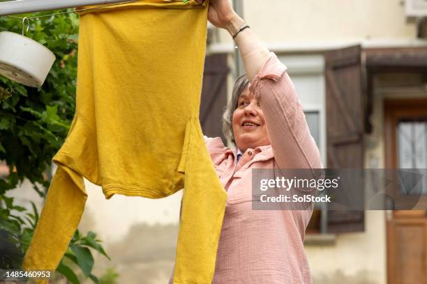 lovely clean clothes - blind woman stock pictures, royalty-free photos & images