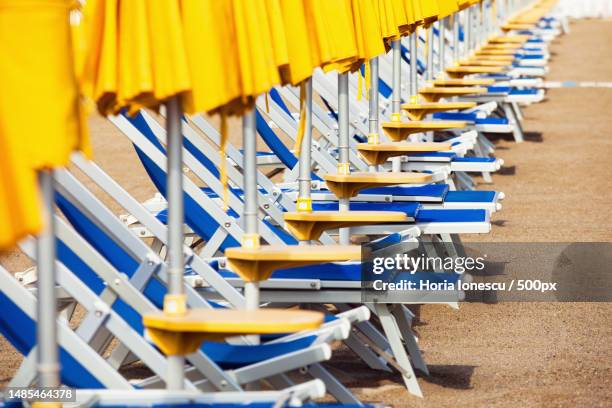 sun beds in a row on beach,romania - romania beach stock pictures, royalty-free photos & images