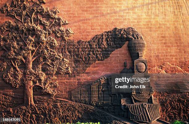 steam train wall sculpture, iron horse legacy, iron horse park, haymarket district. - lincoln nebraska bildbanksfoton och bilder