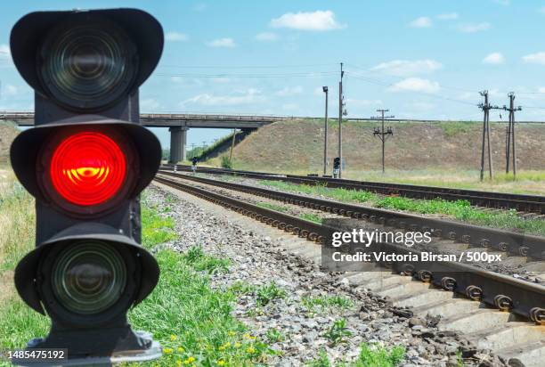 close-up of railroad track against sky,romania - traffic light stock pictures, royalty-free photos & images