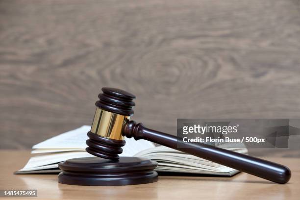close-up of gavel on wooden table,romania - legislation stockfoto's en -beelden