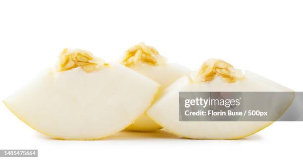 close-up of cheese slices against white background,romania - gladde meloen stockfoto's en -beelden