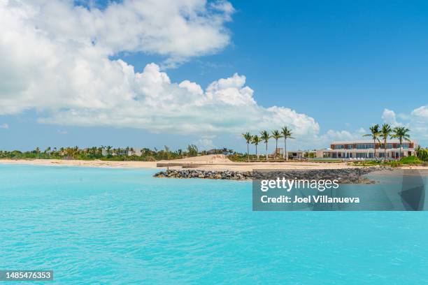 beautiful private beach homes on a secluded island in turks and caicos. - private island stock-fotos und bilder