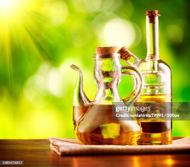 close-up of oil in bottle on table,romania - purity imagens e fotografias de stock