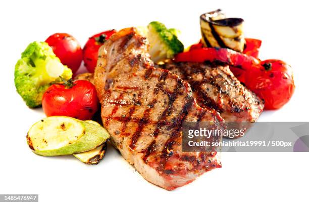 grilled beef steak with vegetables over white background,romania - steak plate stock pictures, royalty-free photos & images