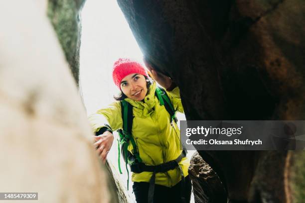 woman in the cave during hiking - inner courage stock pictures, royalty-free photos & images