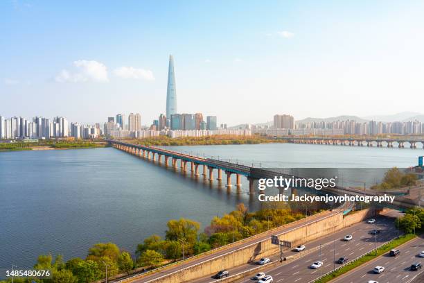 gyeonggi province bridge over river with buildings against sky, south korea - han river photos et images de collection