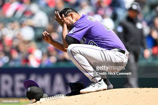 German Marquez of the Colorado Rockies reacts after being injured during the fourth inning against the Cleveland Guardians at Progressive Field on...