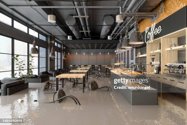 flooded cafe with chairs floating on water - flood insurance stock pictures, royalty-free photos & images