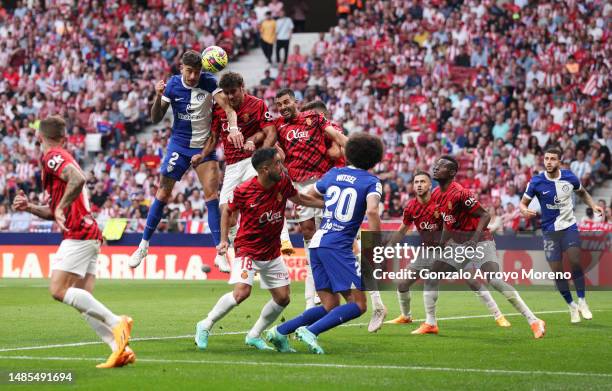 Jose Gimenez of Atletico Madrid jumps for the ball with Abdon Prats of RCD Mallorca during the LaLiga Santander match between Atletico de Madrid and...