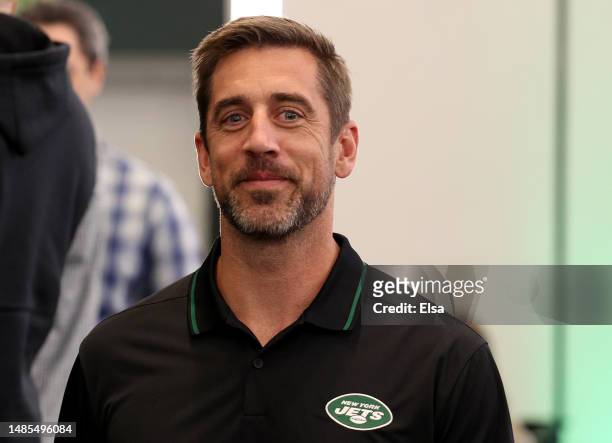 New York Jets quarterback Aaron Rodgers walks out after a press conference to introduce Aaron Rodgers as the new quarterback for the New York Jets at...
