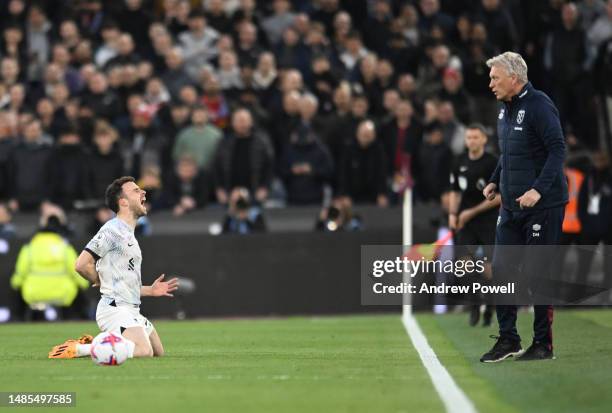 Diogo Jota of Liverpool goes down during the Premier League match between West Ham United and Liverpool FC at London Stadium on April 26, 2023 in...