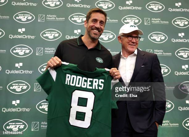 New York Jets quarterback Aaron Rodgers poses with team owner Woody Johnson during an introductory press conference at Atlantic Health Jets Training...