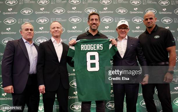 New York Jets team president Hymie Elhai, team owner Christopher Johnson, quarterback Aaron Rodgers, team owner Woody Johnson, and head coach Robert...