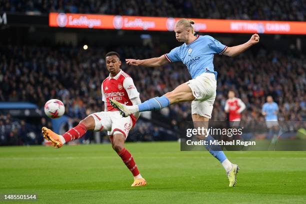 Erling Haaland of Manchester City shoots past Gabriel of Arsenal during the Premier League match between Manchester City and Arsenal FC at Etihad...