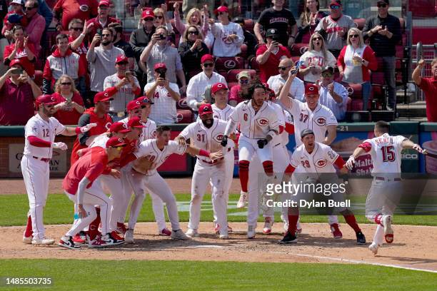 Nick Senzel of the Cincinnati Reds celebrates with teammates after hitting a walk-off home run in the ninth inning to beat the Texas Rangers 5-3 at...
