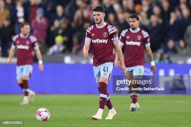 Declan Rice of West Ham United looks dejected after Joel Matip of Liverpool scores the team's second goal during the Premier League match between...