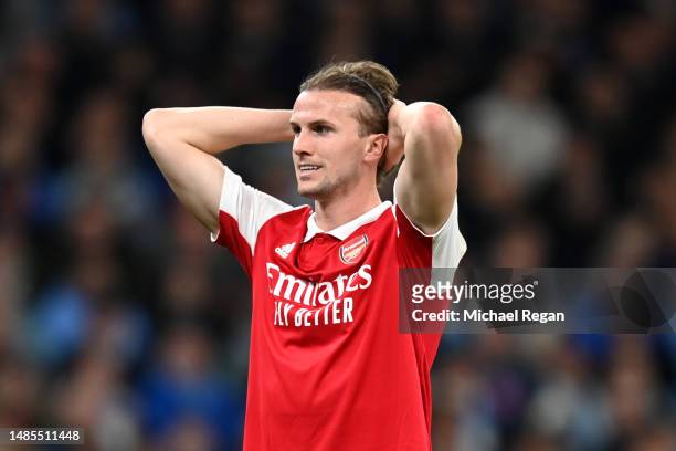 Rob Holding of Arsenal reacts after Manchester City scored their sides third goal during the Premier League match between Manchester City and Arsenal...